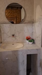 a bathroom with a sink and a mirror at Bamboo Craft Homestay in Sangyang +82 photos