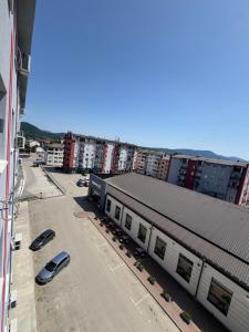 an aerial view of a city with buildings and cars at NelaLux 2 in Bratunac