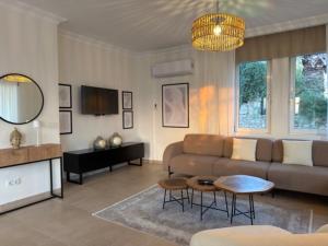 a living room with a couch and a table at Villa Zalin in Ovacik
