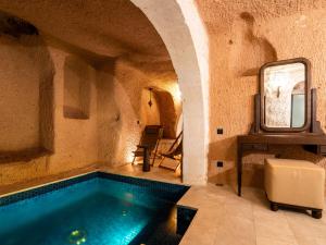 a bathroom with a swimming pool in a building at Cybele in Cappadocia in Uçhisar