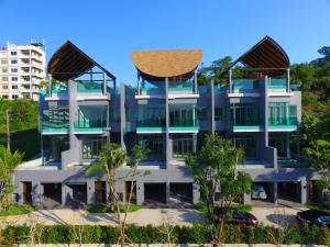a building with a basket on top of it at Bukit Pool Villas - SHA Extra Plus in Patong Beach