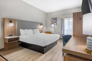 a hotel room with a bed and a desk at Best Western Inn Florence in Florence +44 photos