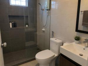 a bathroom with a shower and a toilet and a sink at Mercado de Casa C in Silao