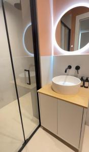 a bathroom with a sink and a mirror at Cosy place in Pembroke in Pembroke