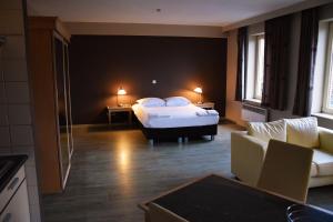 Postel nebo postele na pokoji v ubytování Ambassador Suites Antwerp