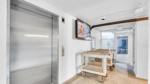 a room with a walk in closet and a glass door at Romar Tower 1B in Orange Beach