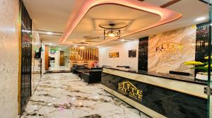 a lobby of a hotel with a marble floor at Standard Elite Palace inn Hotel in Islamabad