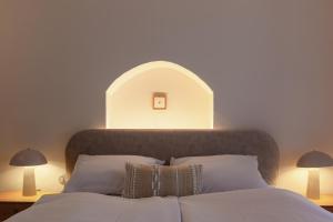 a bedroom with a bed with an arch above it at Pension Marie in Český Krumlov