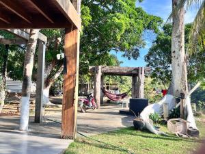 a hammock in a pavilion next to a tree at Rancho Nova Car in Ariquemes