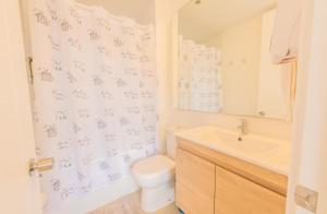 a bathroom with a toilet and a sink at Oceana Suites Papudo in Papudo +17 photos