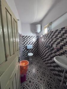 a bathroom with a toilet and a sink at Alpine Homestay in Joshīmath