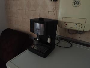 a coffee maker sitting on top of a counter at Стая за гости При Валко in Belogradchik
