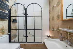 a bathroom with a shower and a sink at Am Silberbergblick in Bodenmais