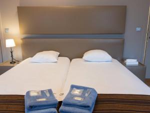 Postel nebo postele na pokoji v ubytování Hotel Villa Escale