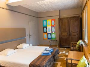 Postel nebo postele na pokoji v ubytování Hotel Villa Escale