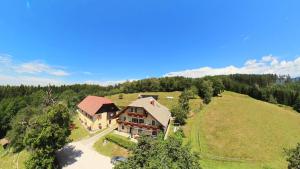 an aerial view of a large house on a hill at Ferienhaus Huber in Bleiburg