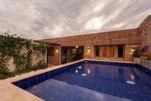 a swimming pool in the backyard of a house at Casa De la alegría Boutique in Cartagena de Indias