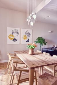 a dining room with a wooden table and chairs at La Dimora Guest House in Castel di Sangro