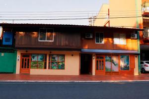 a building on the side of a street at Borus Hostel in Puerto Iguazú