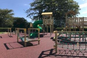 a playground with a slide in a park at Glendale Holiday Park in Wigton