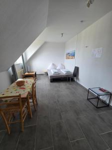 a living room with a couch and a table at Holidayapartment Bella Napoli in Liblar