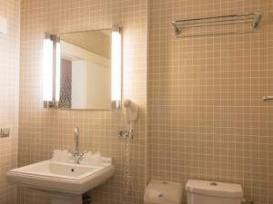Koupelna v ubytování Hotel Villa Escale
