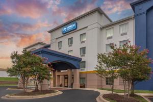 a rendering of a hotel building with trees in front at City Express by Marriott Elkridge in Elkridge