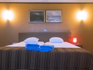 Postel nebo postele na pokoji v ubytování Hotel Villa Escale