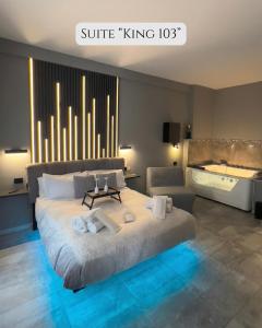 a bedroom with a large bed and a bath tub at HeySuite Trastevere GuestHouse ROMA in Rome