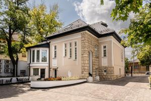 a large brick building with a lot of windows at Nádor Rezidencia in Győr
