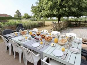 a white table with food on top of it at Ferme de la Galoperie in Couvin