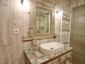 a bathroom with a sink and a mirror at Ferme de la Galoperie in Couvin +38 photos