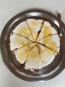 a pie on a plate on a table at Praia Grande Ecolodge in Manacapuru