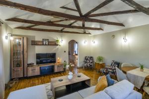 a living room with a couch and a table at Silk House in Souflíon