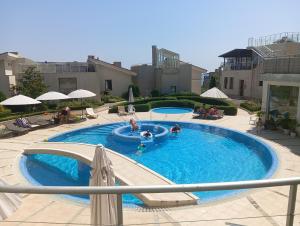 a group of people in a swimming pool at Sun Village House 14 in Byala
