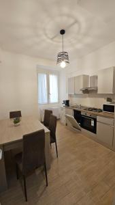 a kitchen with a table and chairs in a room at Mare Apartment in Nocera Inferiore