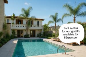 a house with a swimming pool and a sign that reads pool access for our guests at Old Town Suites Muradie in Vlorë