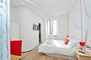מיטה או מיטות בחדר ב-Design Apartment Paulina 300 mt from Colosseum