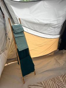 a chair sitting inside of a tent at Glamping - accès JACUZZI et SAUNA in Boulogne-sur-Mer +8 photos