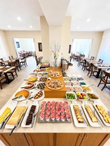 a long table filled with different types of food at Hotel Liu in Lido di Camaiore