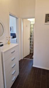 a room with a white dresser and a closet at Apartment Vanessa in Murine
