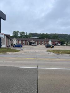 an empty parking lot in front of a building at Quality Inn in Council Bluffs
