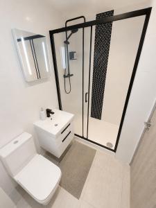 a bathroom with a shower and a toilet and a sink at AS Residences in Preston +5 photos