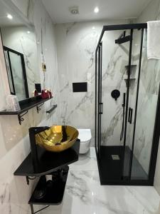 a bathroom with a sink and a shower and a toilet at Core Salentino Rooms in Campomarino +16 photos