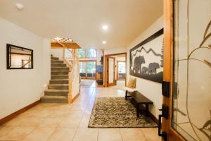 a hallway with a staircase and a stair case at Luxury Cabin on Golf Course / Private Spa & Launch in Prattville