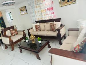 a living room with two couches and a coffee table at Carrasco D in Nagua