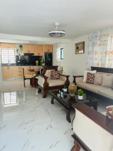 a living room with a couch and a table at Carrasco D in Nagua