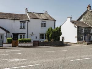 a row of white houses on a street at Fountain Cottage in Keswick