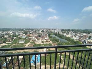 a view of a city from a balcony at Cinema Experience -Premium Studio in Karnal +10 photos