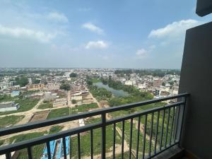 a view of a city from a balcony at Cinema Experience -Premium Studio in Karnal
